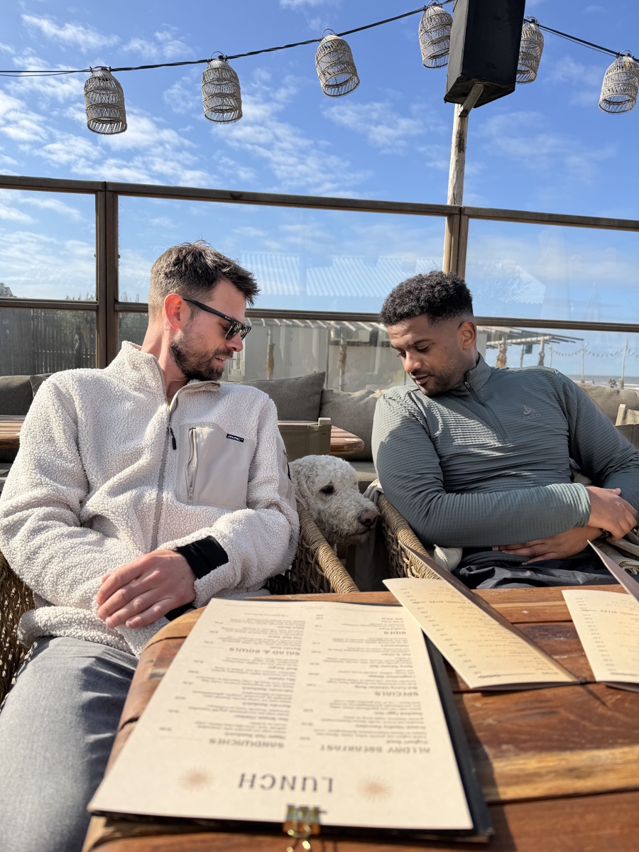 Two friends in conversation over lunch