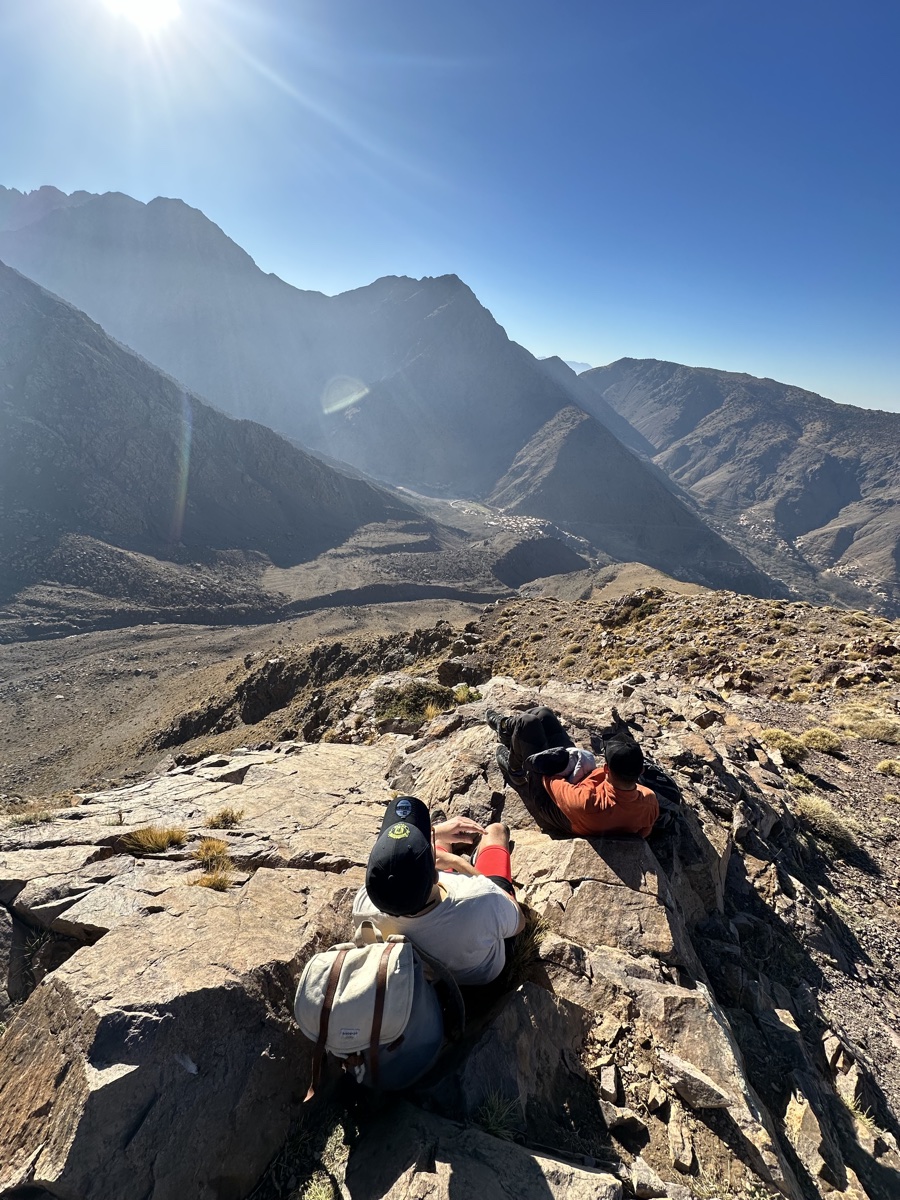 Resting on a mountain ridge at golden hour